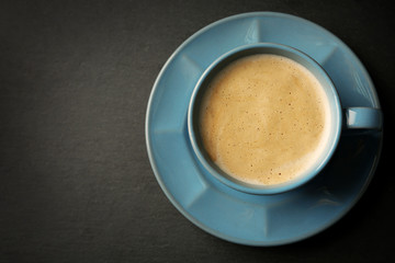 Cup of coffee on gray background