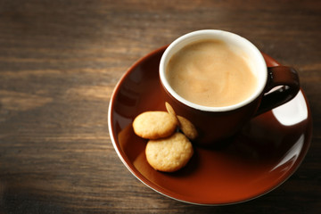 Cup of coffee on wooden background