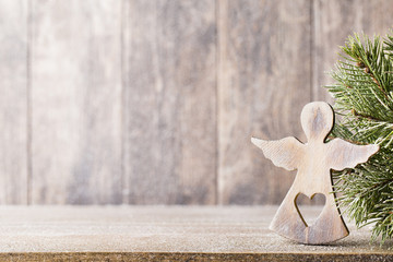 Christmas fir branch and decor, on the wooden background.
