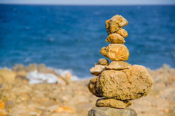 Stack of stones on sea shore, Aruba