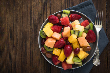 Plate full of healthy exotic fruits slices