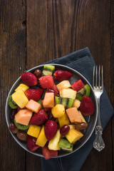 Plate full of healthy exotic fruits slices