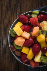 Plate full of healthy exotic fruits slices