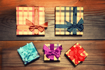 Festive gifts background. Boxes, tapes. Holiday card. The photo is tinted in a retro style.