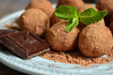 Chocolate truffles on a vintage plate.