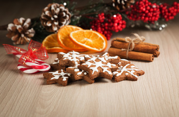 Christmas cookies on a wooden surface with the background decor