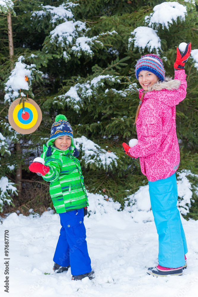 Wall mural kids plaing in the snow