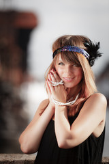 Flapper girl woman in1920s style portrait outdoor
