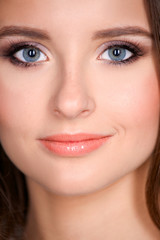 Fototapeta premium Portrait of an attractive fashionable young brunette woman