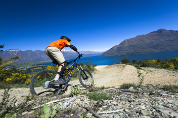 Fototapeta premium Mountain bike rider on bike path in Queenstown, New Zealand