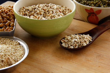 job's-tears are on wooden background.