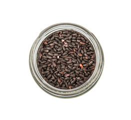 Black millet in mason jars over wooden background