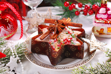 Fototapeta na wymiar star shaped cake with dried fruits for christmas