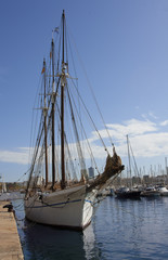 Fototapeta na wymiar Sailing ship and yachts in the harbor of Barcelona. Spain.