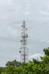 transmitters and aerials on the telecommunication tower whit cloudy