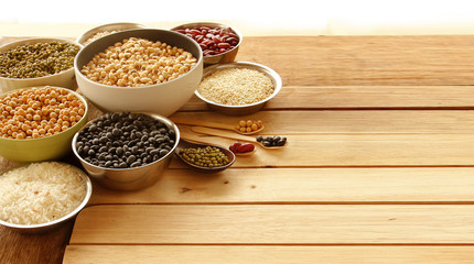 Different kinds of Grains, five grains put on wooden background.