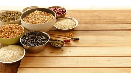 Poster Different kinds of Grains, five grains put on wooden background. © Jazper4153