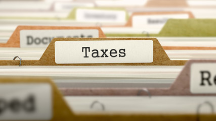Taxes Concept on Folder Register.