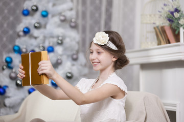 happy smiling girl with gift box over white room background
