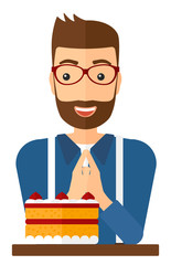 Man looking at cake.