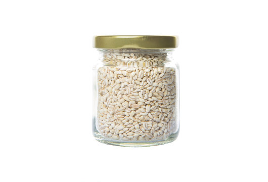 White Millet Grain Seed In Mason Jar Over White Background