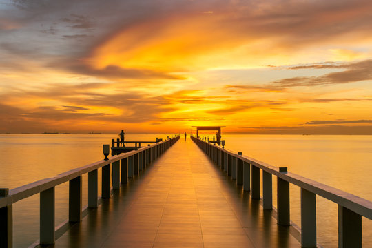 Fototapeta Wooden pier between sunset in Phuket, Thailand