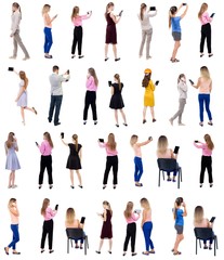 Collection " Back view people use smartphones and tablets. ".