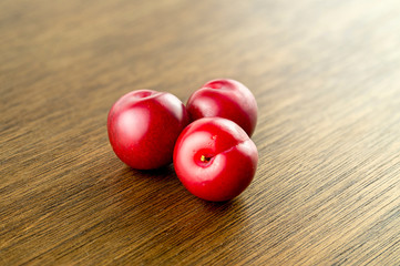 Sweet ornamental cherry plum fruits on stylish gourmet backgroun