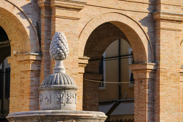 Fototapeta premium Ancient fountain with pinecone on Cavour square in Rimini, Italy