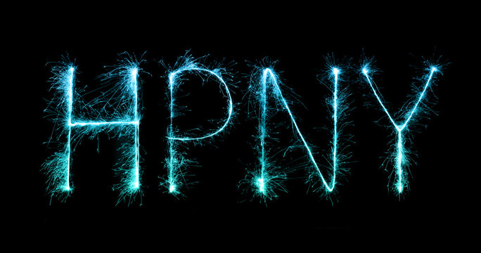 Happy New Year made of sparkles firework at night