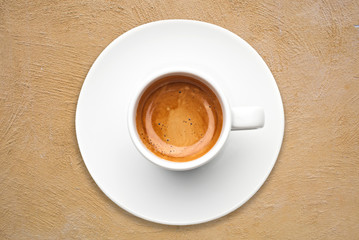 top view a cup of espresso coffee with yellow cement background - 97704579