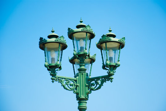 The street lamp with blue shy in background