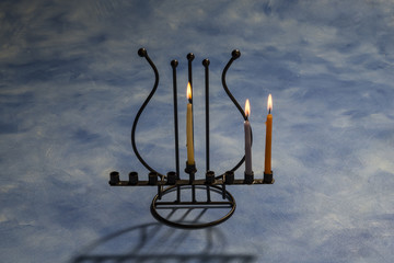 Two burning Hanukkah candles in Menorah © studiodr