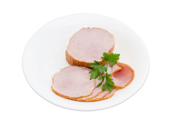 Pork loin and sprig of parsley on a white plate