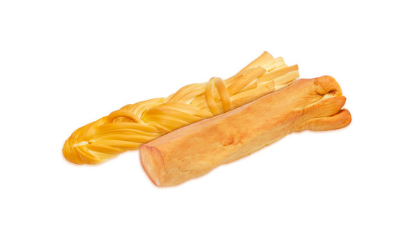 Braided and stick chechil cheese on a light background
