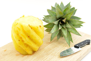 Pineapple on wooden board