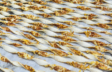 many twist bread sticks with cheese and cinnamon