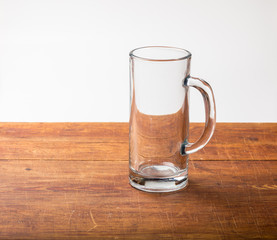 Empty beer mug on wood