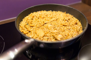 Pan with homemade risotto and cep mushrooms