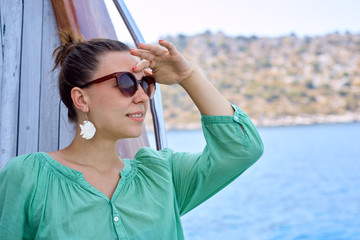 young woman riding on a yacht in Turkey