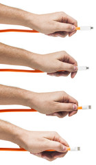 Orange. USB cable in the man`s hand. Set.