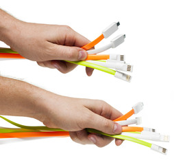 USB cables in the man`s hand. Set.