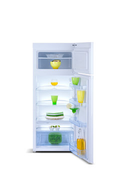 Open Refrigerator with fresh food Isolated on white.