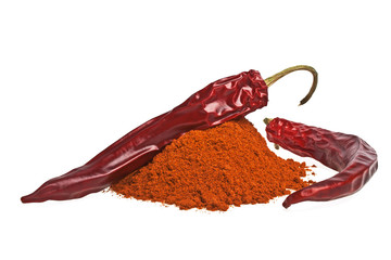 Red peppers with its powder on a white background