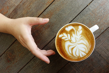 a cup of latte art coffee.