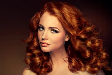 Crédence de cuisine en verre imprimé Salon de coiffure Girl model with long red wavy hair. Big curls on the red head . Hairstyle  permanent waving