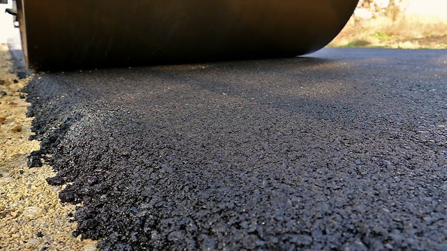 Heavy Vibration roller compactor at asphalt pavement works