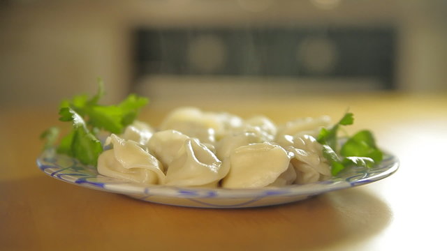 Plate with dumplings on a table