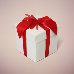 Gift box with red ribbon and bow.