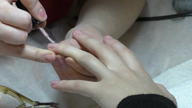 Girl doing beautiful nail design